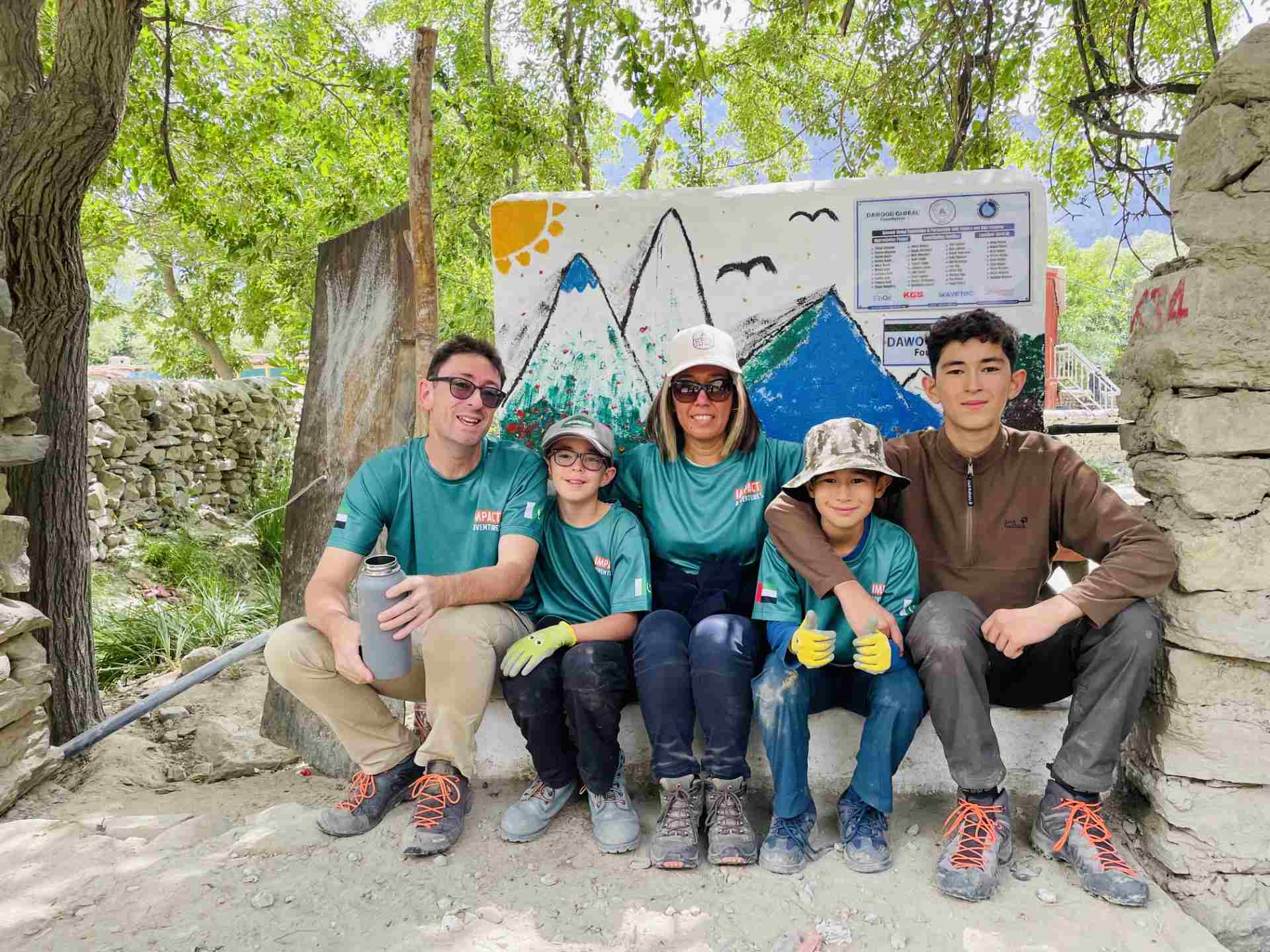 Kuntay Simbatova and her family sit at the edge of a well. 