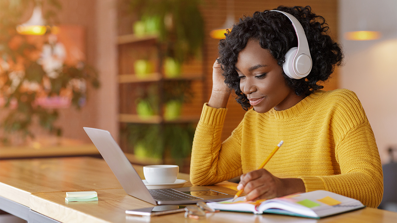 Woman on tablet reviewing credit documents