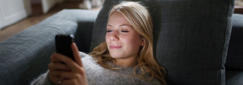 woman online banking on mobile device