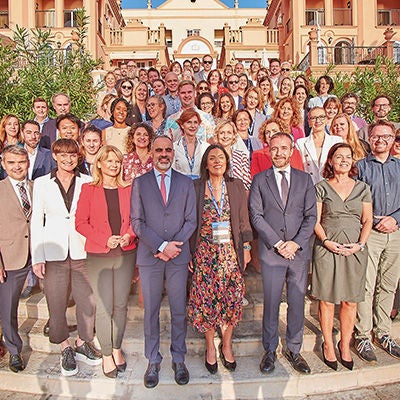 Large group of people standing at the European Travel Commission event.
