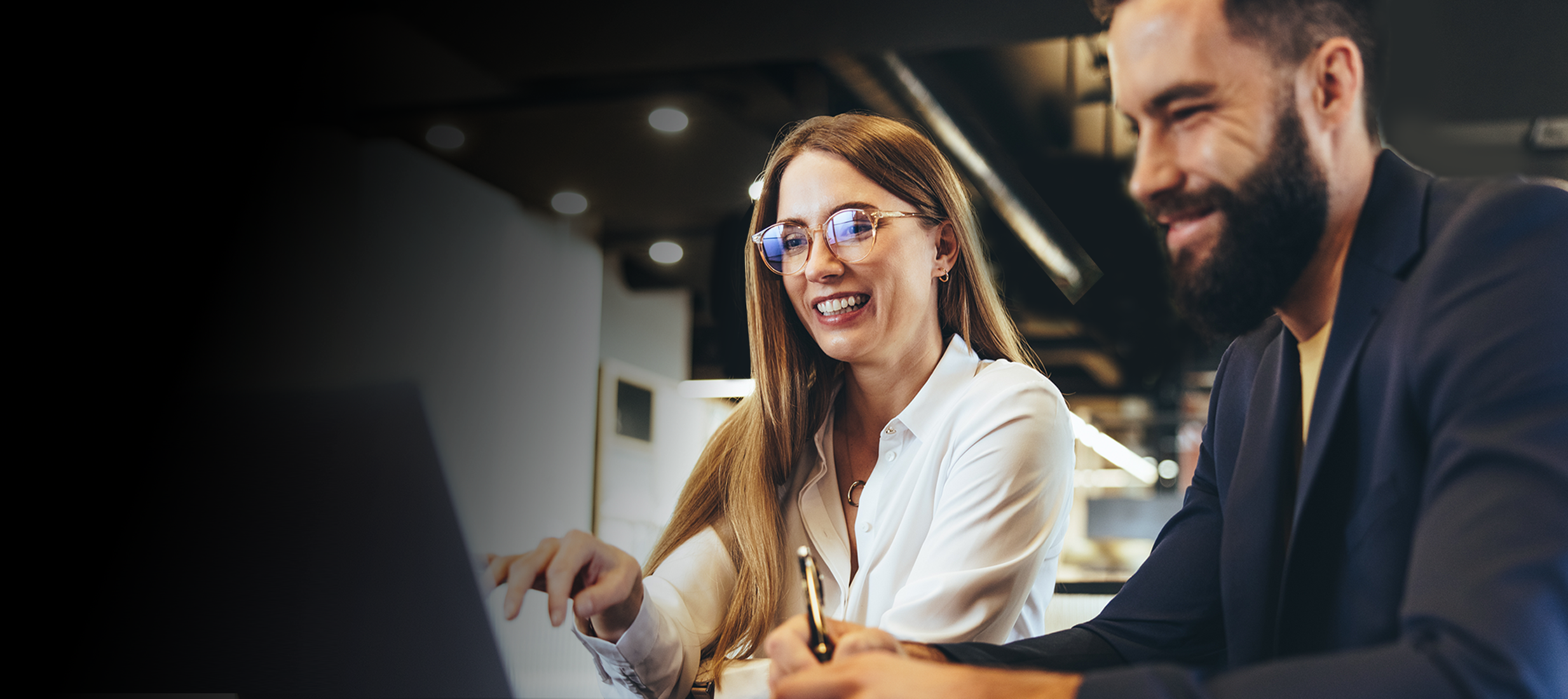 Two coworkers brainstorming on the computer