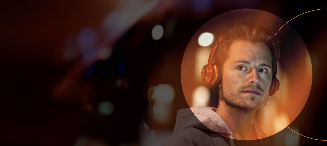 Man with headphones looking at the camera