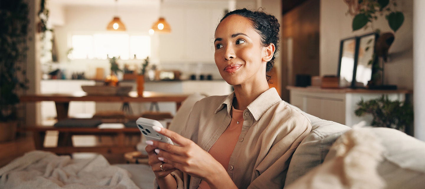 Woman on her phone in her home