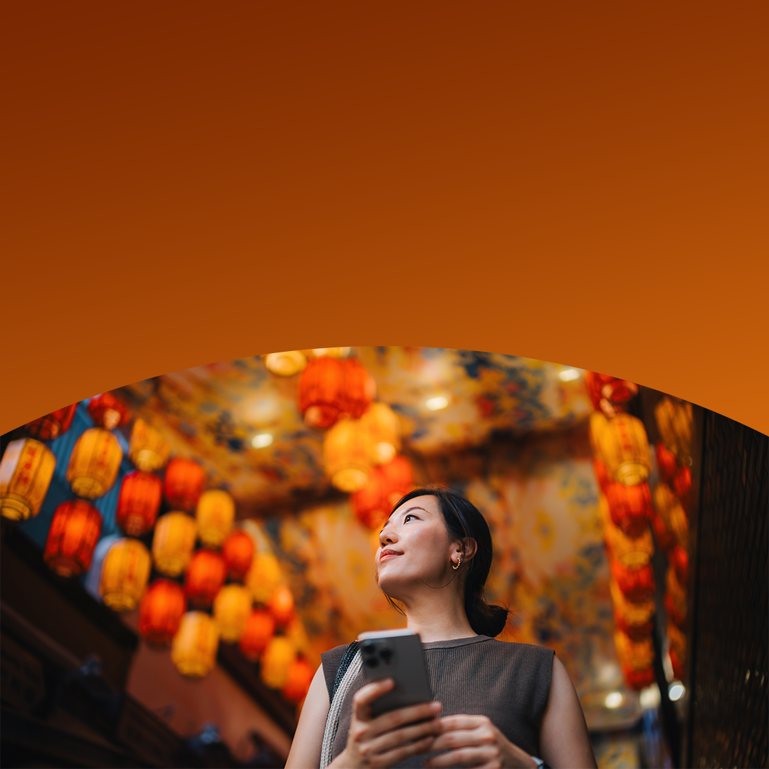 woman in retail market holding phone