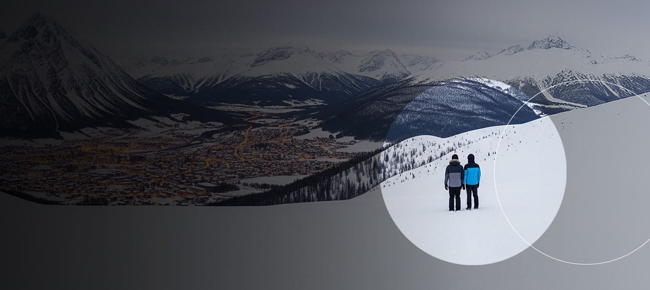 couple watching waves on rocky coast