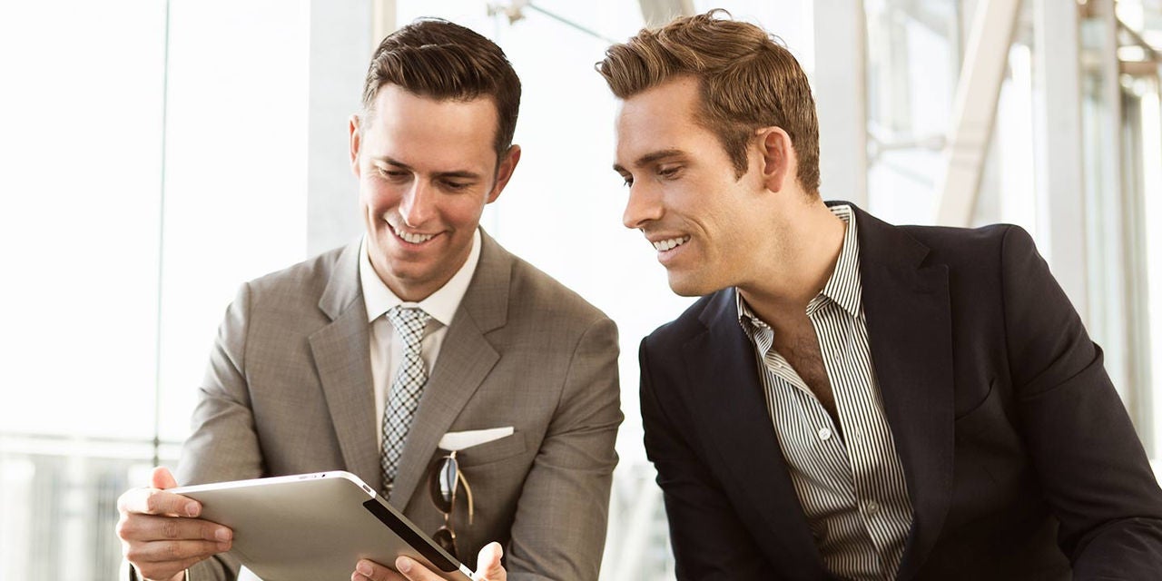 Two businessmen with tablet