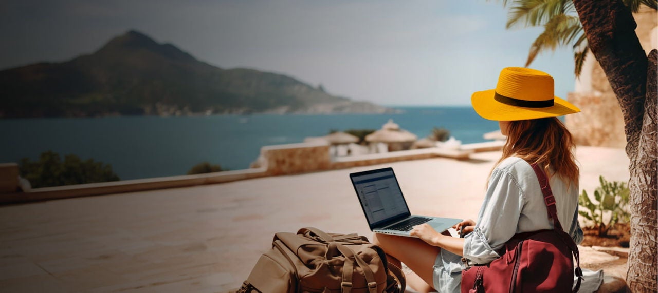 woman working remotely by ocean