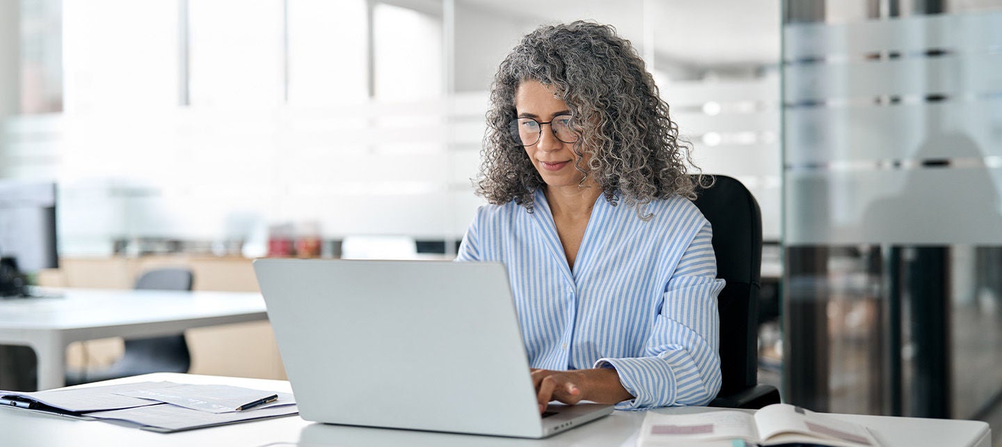 Woman analyzing data on her tablet
