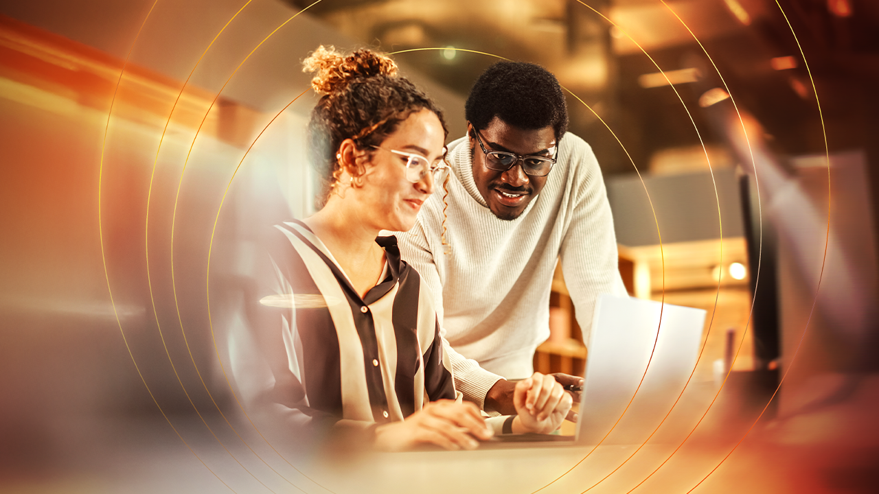 Man and woman on computer in the office