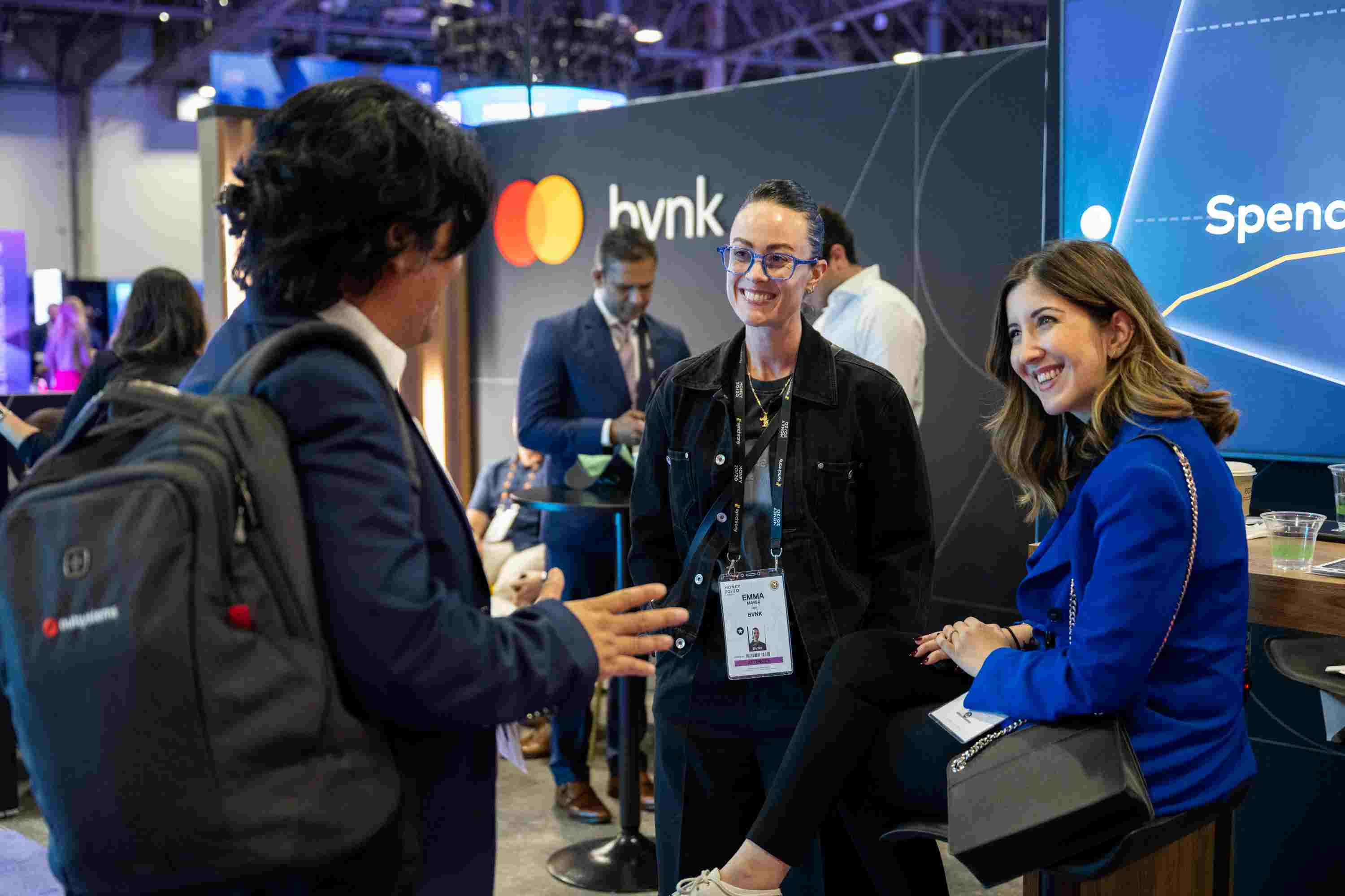 People at the BVNK booth at Money 20/20. 