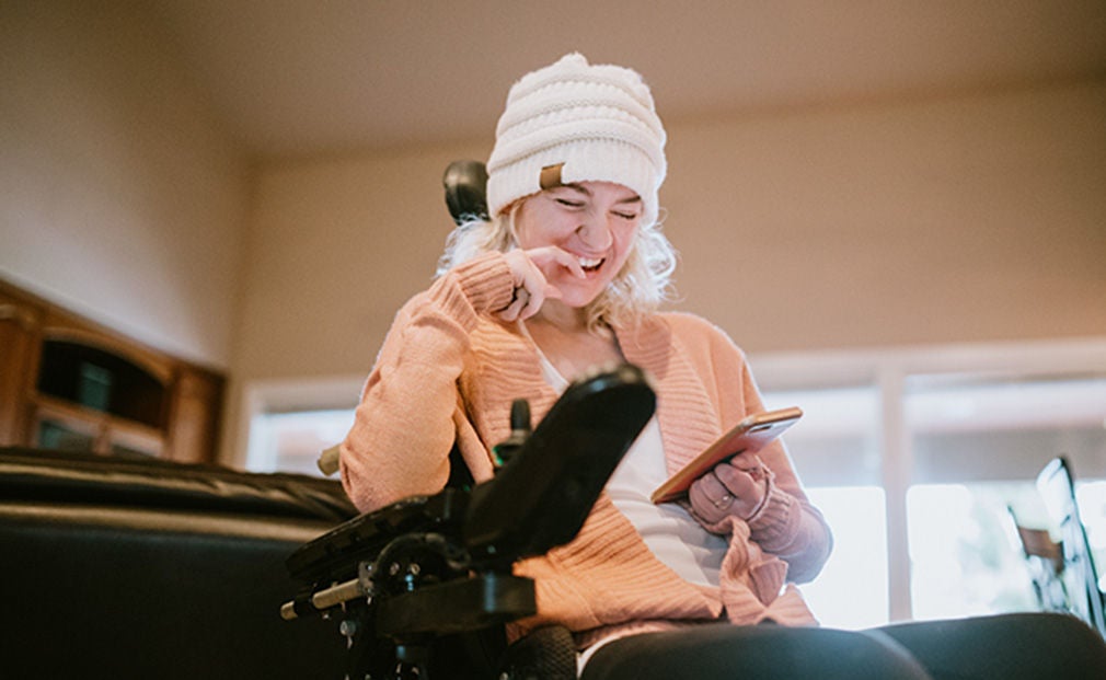 Happy woman in a wheelchair