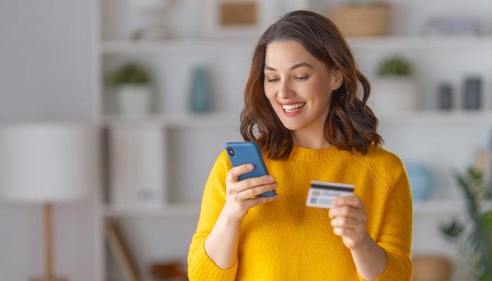 Woman making an online payment on her phone
