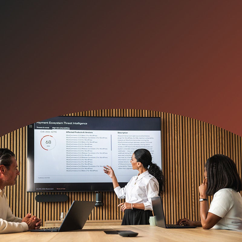 Woman speaking while pointing at screen