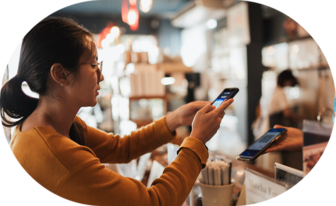 Woman taking a picture of a retail item with a phone