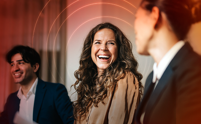woman smiling looking at other teammate