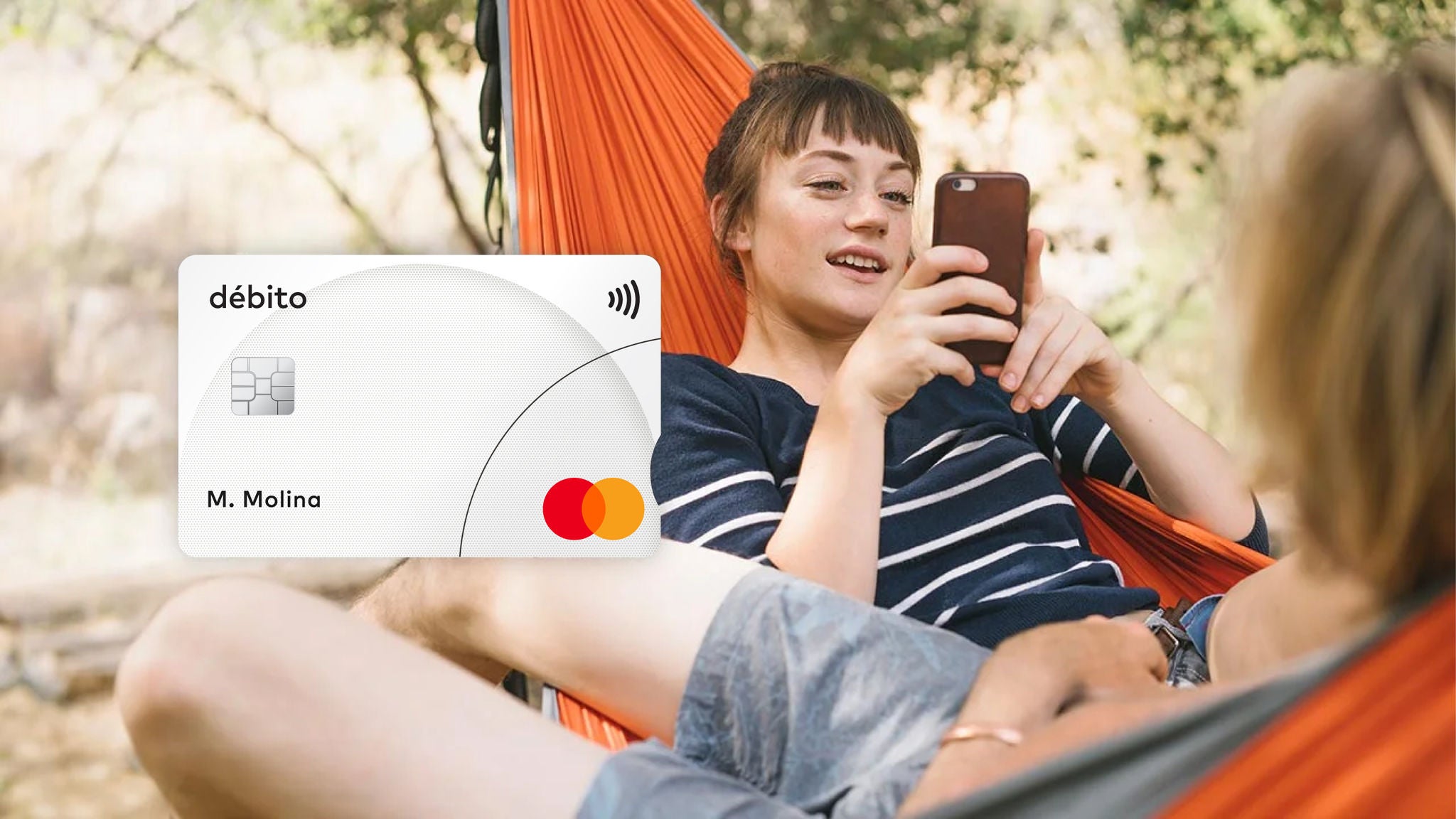 Two friends relaxing in a hammock and an image of a Mastercard debit card.
