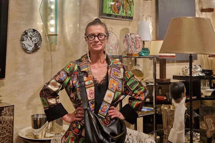 Woman with hands on hips looking into camera