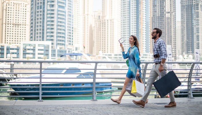 Couple walking on a pier