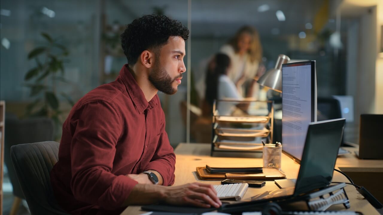 A man is doing office work on computer 