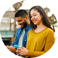 Woman and man looking at their phones
