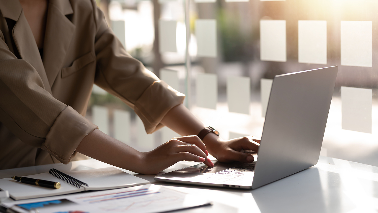 Woman typing on laptop