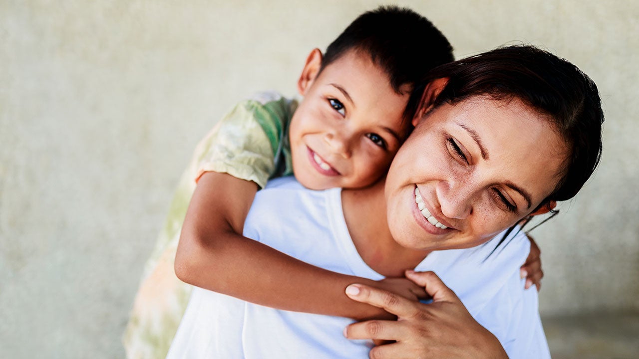 A child hugging mom.