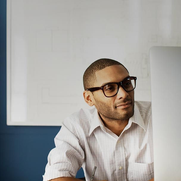 Man at desk with computer.