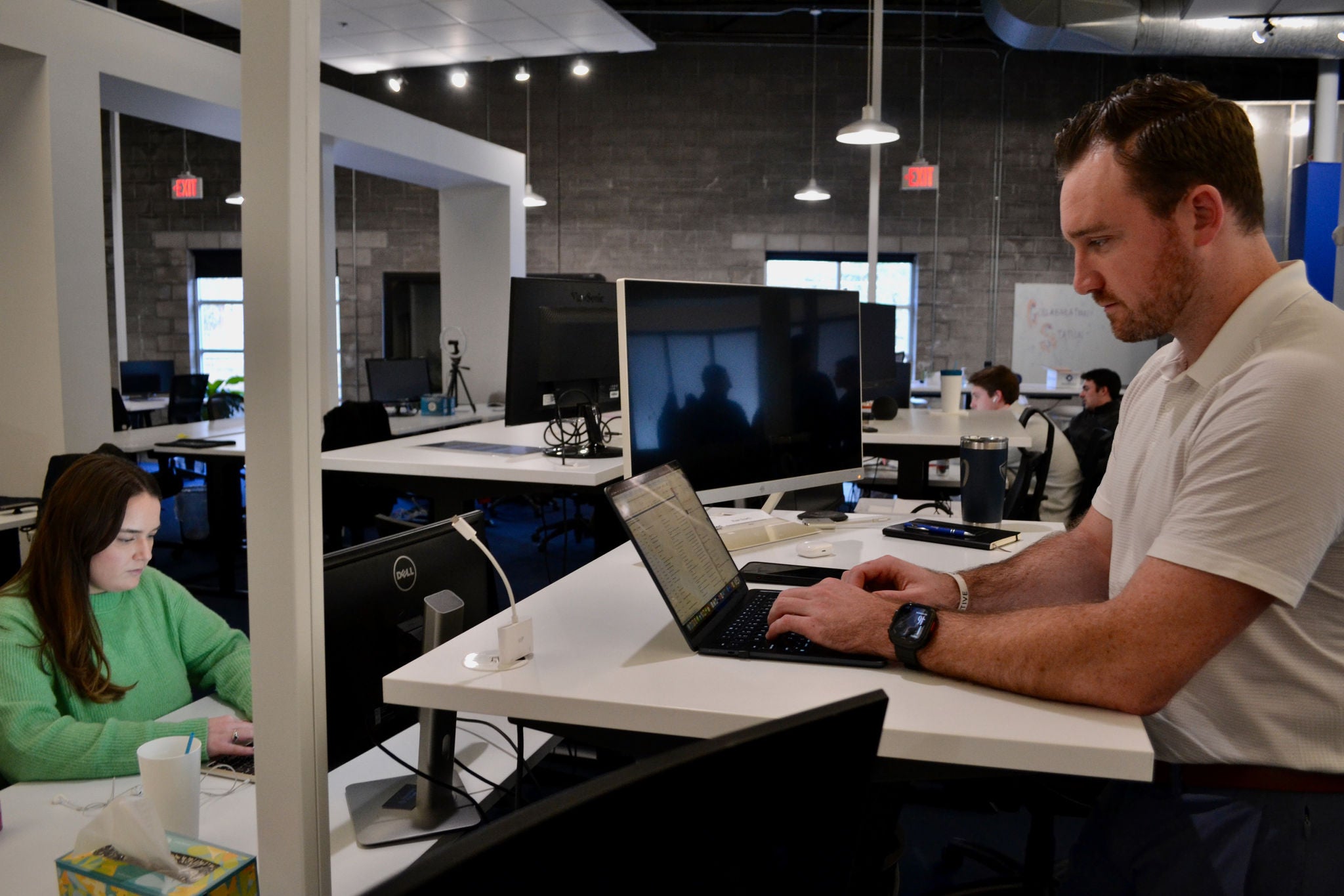 Two employees working inside Recorded Future.