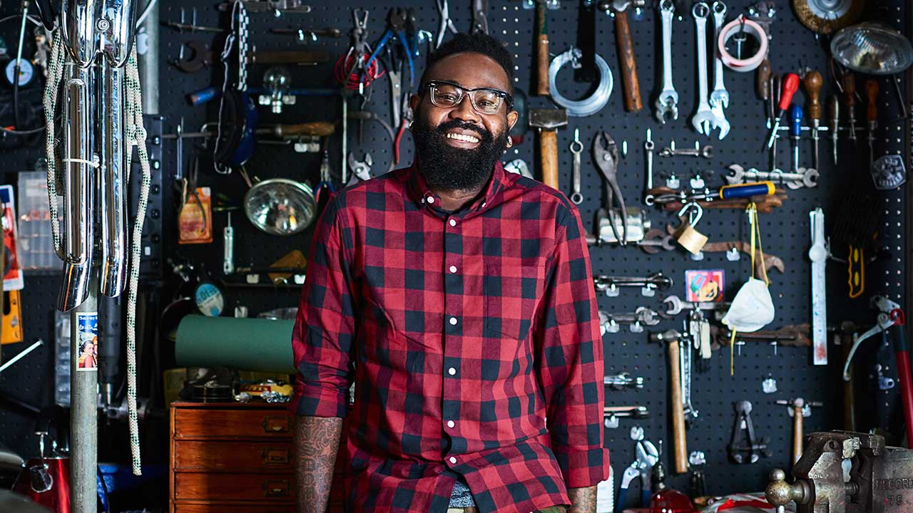 Smiling male business owner in his workshop.