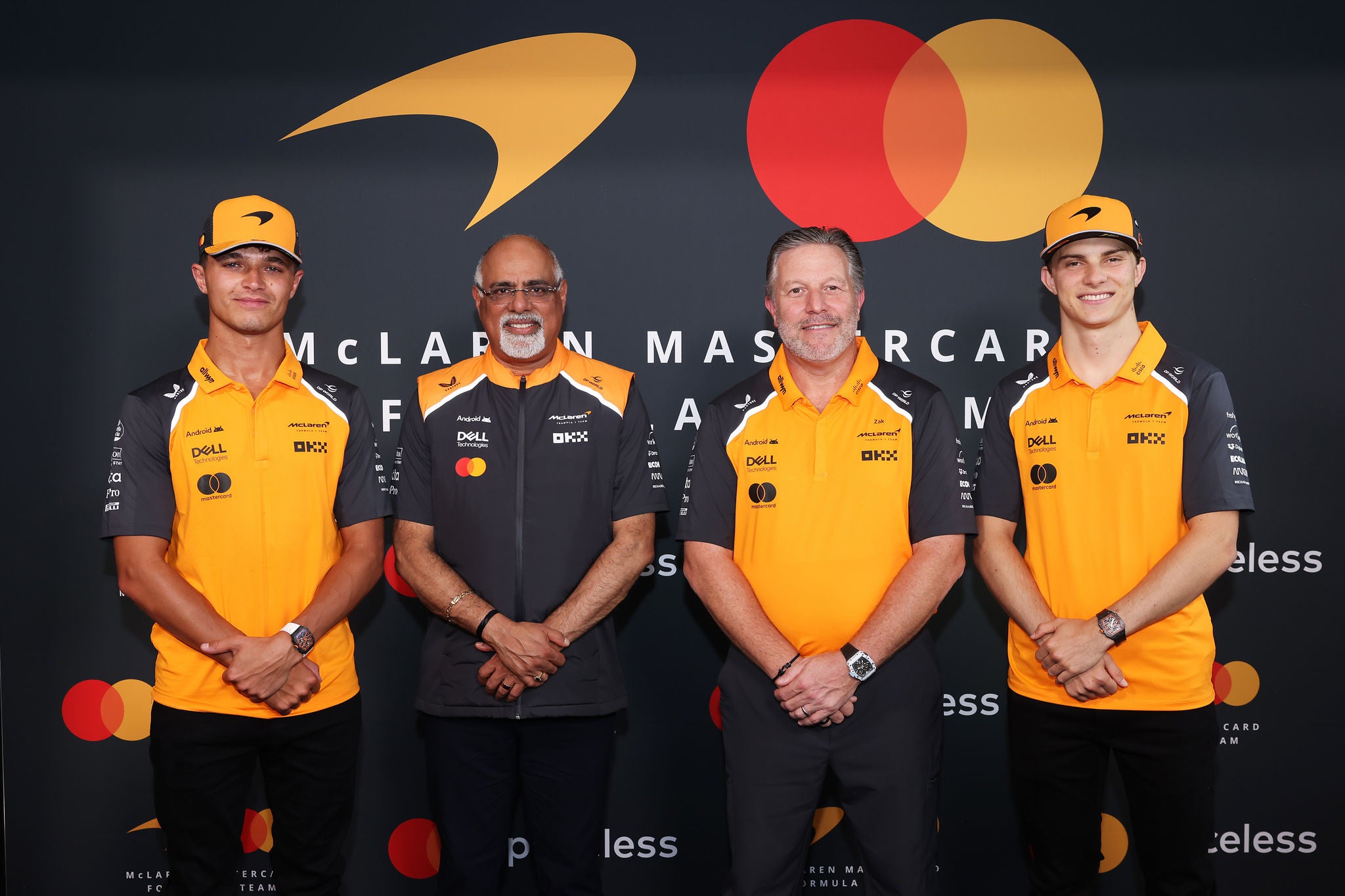 AMSTERDAM, NETHERLANDS - AUGUST 27: Lando Norris of Great Britain and McLaren, Raja Rajamannar, Chief Marketing and Communications Officer, Mastercard, Zak Brown, Chief Executive Officer of McLaren and Oscar Piastri of Australia and McLaren pose for a photo as McLaren Racing Announces Mastercard as Official Naming Partner of McLaren Formula 1 Team from 2026 at Gashouder Westergasfabriek on August 27, 2025 in Amsterdam, Netherlands.  (Photo by Andrew Ferraro/Getty Images for Mastercard)