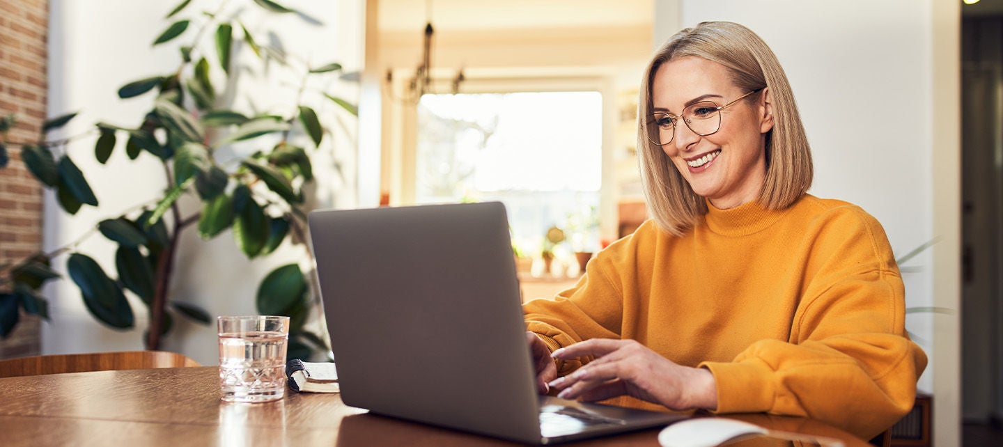Happy woman working on her computer