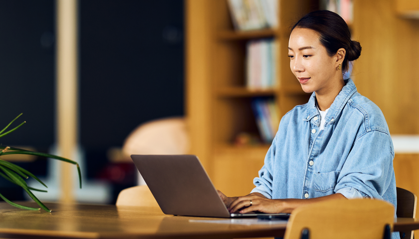 Woman on her laptop working in the library