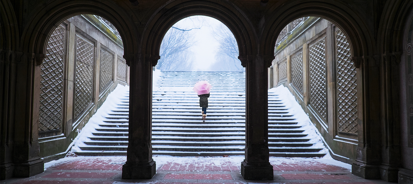 Women going upstairs to a snowy weather