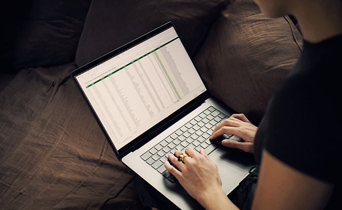 Hands on laptop keyboard