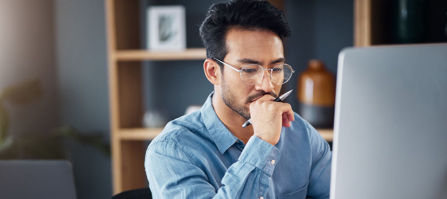 Man thinking while using computer