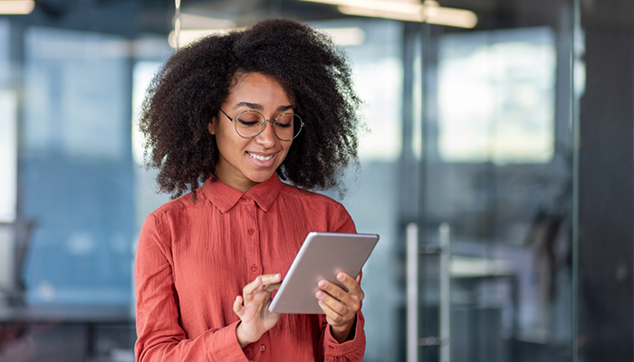 Woman analyzing data on her tablet