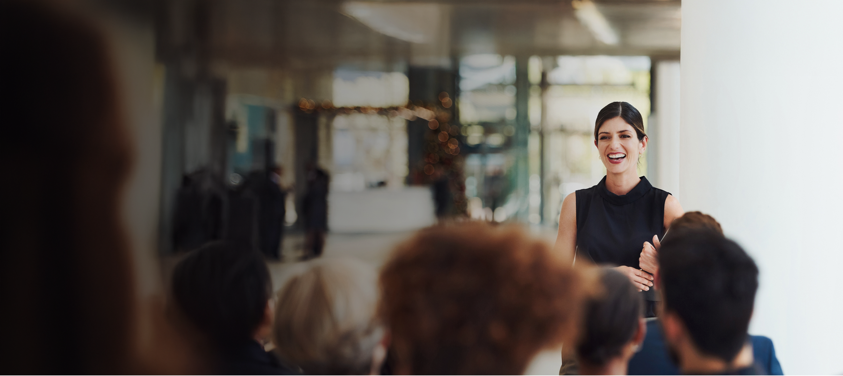 A woman standing in front of people