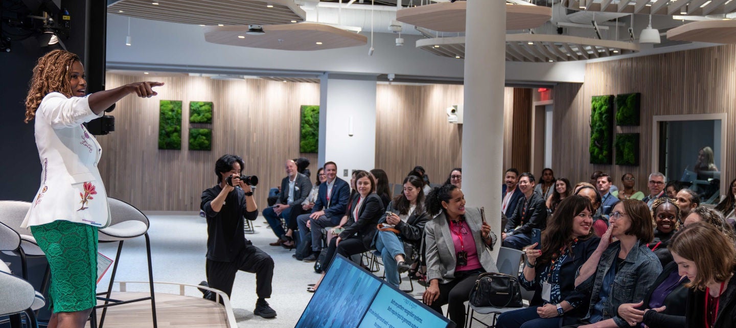  Cassandra Freeman speaks to small business owners , pointing to one of them, at the Mastercard Small Business Summit in New York City. 