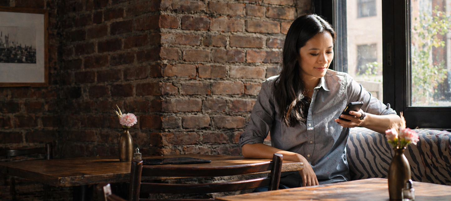 Woman use phone in coffee shop