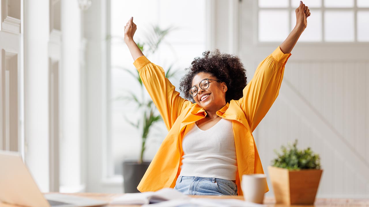 Relaxed small business owner in office.