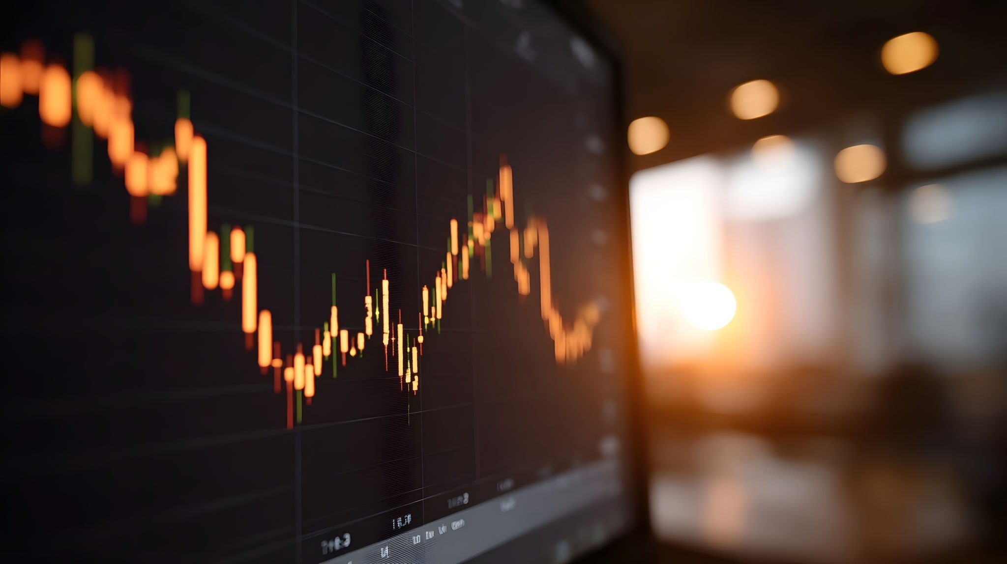 Close up view of a dynamic market candlestick chart showing price fluctuations against a blurred sunset backdrop with bokeh lights