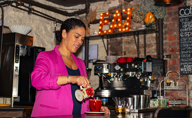 Businesswomen pouring coffee