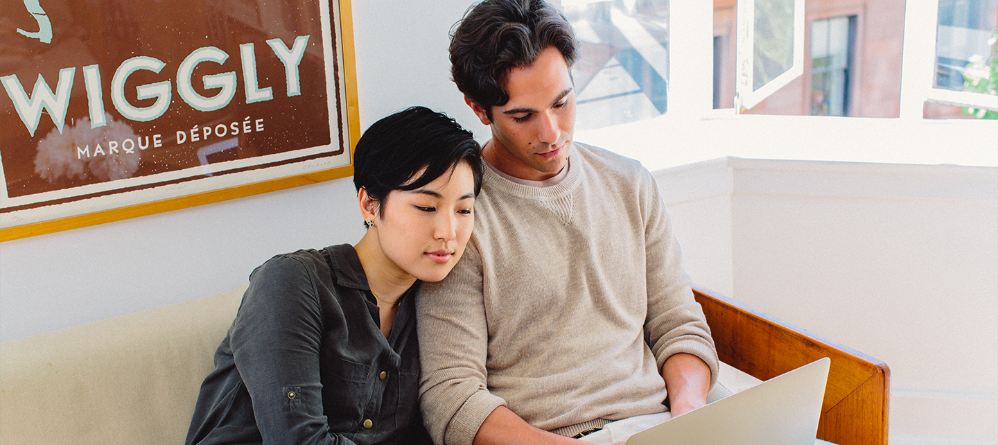 Couple watching a computer