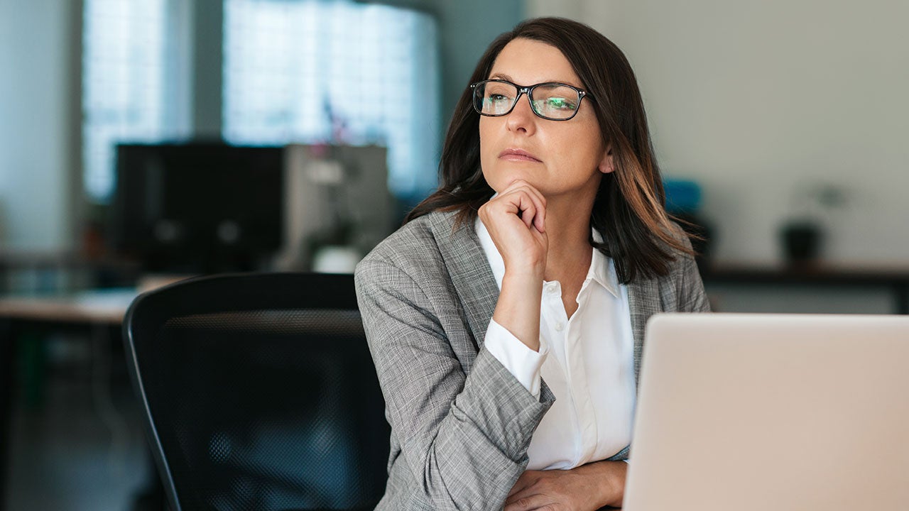 Businesswoman thinking about work matters.