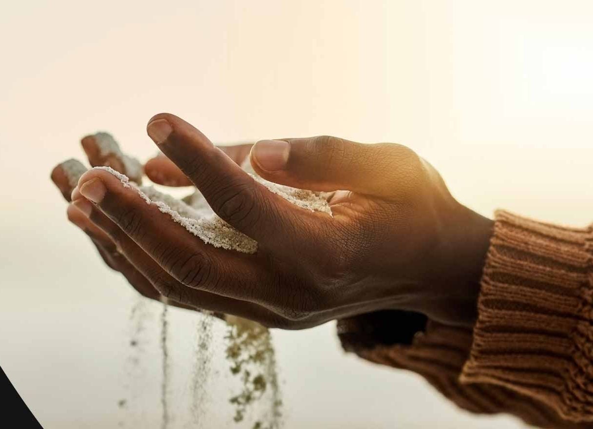 Hands picking up sand
