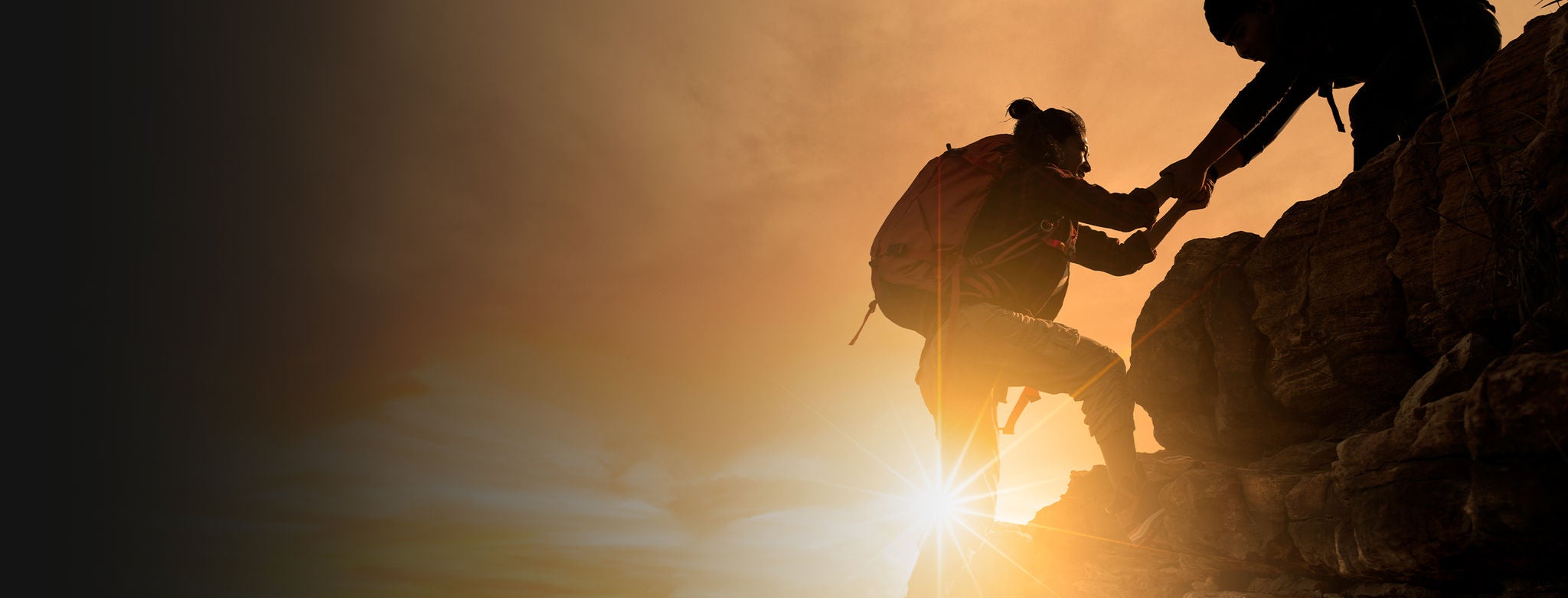 People rock climbing