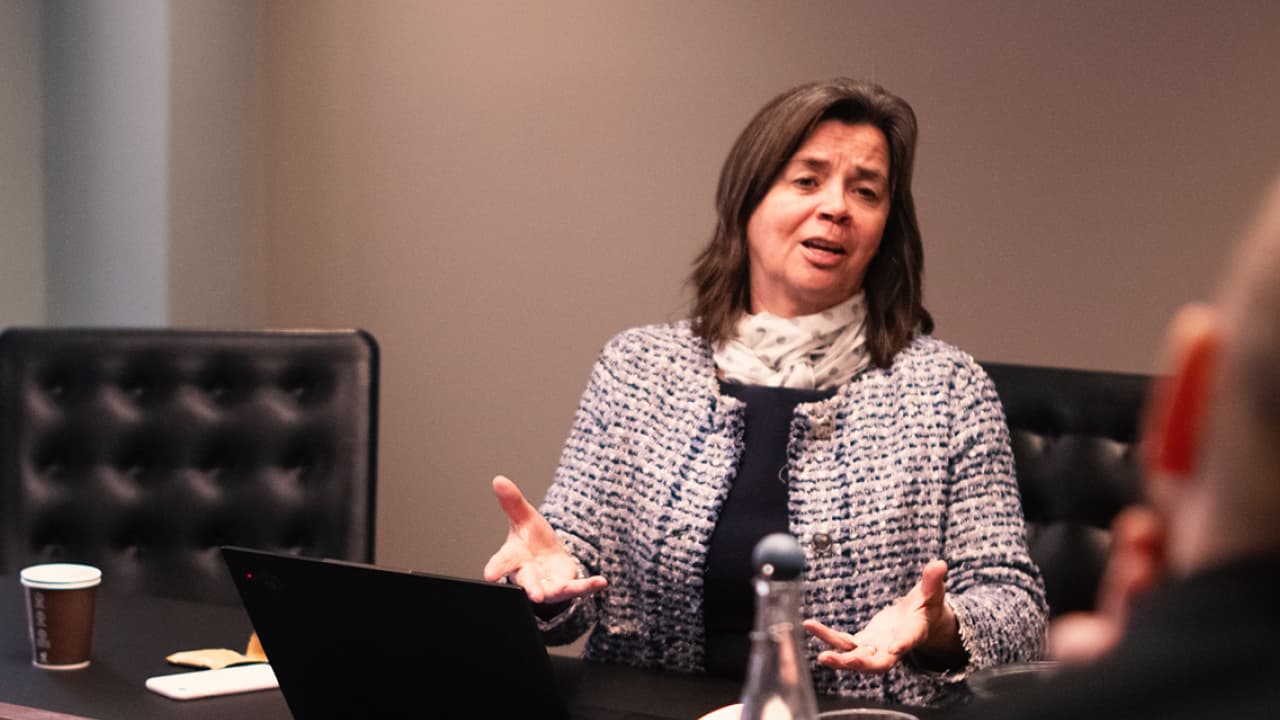 woman speaking in an office meeting