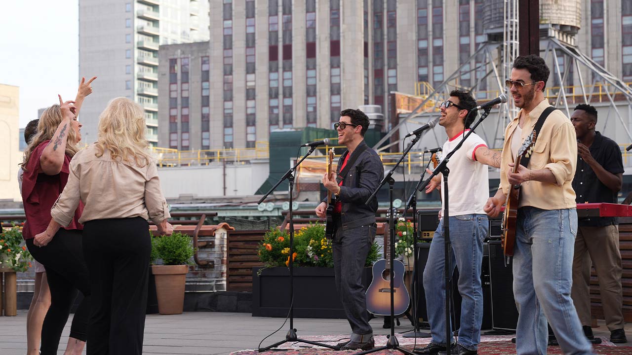 Jonas Brothers performing.