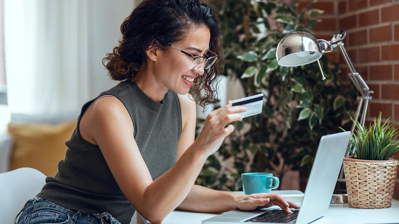 Woman paying for online shopping using credit card