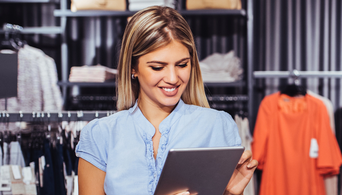Smiling woman using digital tablet